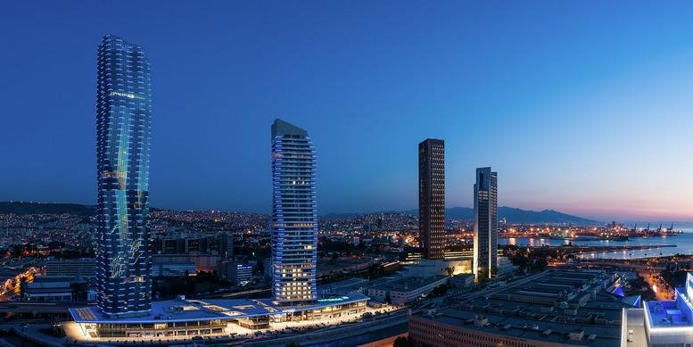 Exterior view of the modern high-rise towers of Mistral Izmir against a twilight sky.