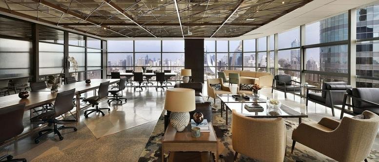 Spacious open-plan lounge and coworking area at Gaysorn Tower Bangkok with expansive city views.