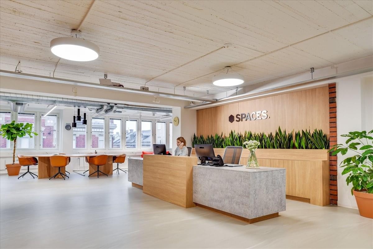 Bright reception area at First Floor, Building U07, Zone 3, Street 983, Msheireb Downtown Doha with wooden accents.
