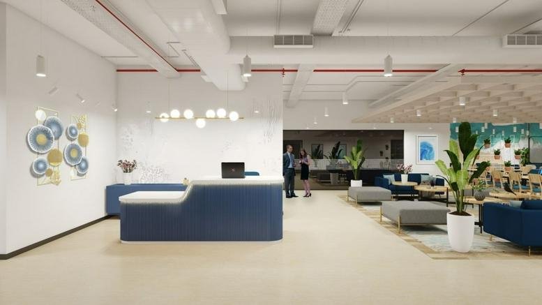 Spacious reception area with a blue desk and modern lighting at Campus 3B, RMZ Millenia 11.
