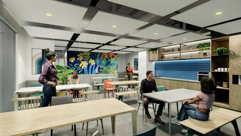 Spacious communal breakout area at Candor Techspace, Noida, India with modern seating and vibrant floral mural.
