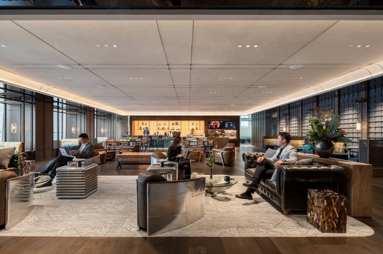 Spacious communal lounge at Level 18, China World Tower A with modern armchairs and floor-to-ceiling windows.