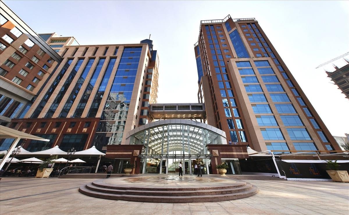 Exterior view of the glass and stone facade of Concorde Towers at UB City.