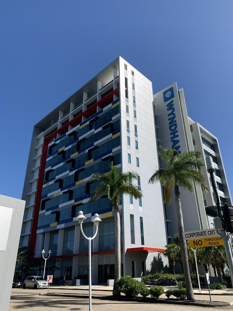 Exterior view of the modern multi-story Corporate Centre Two at 1 Corporate Court.
