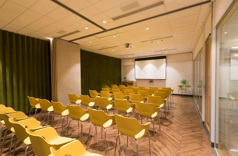 Spacious presentation room at Dextrus, Crescenzo C 38/39, G-Block, Bandra Kurla Complex, Mumbai with yellow chairs.