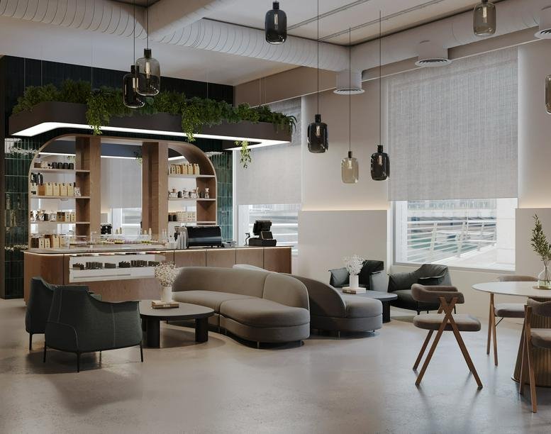 Spacious lobby at Dubai Hills Estate Business Park, Building 4 with curved sofas and a modern coffee bar.