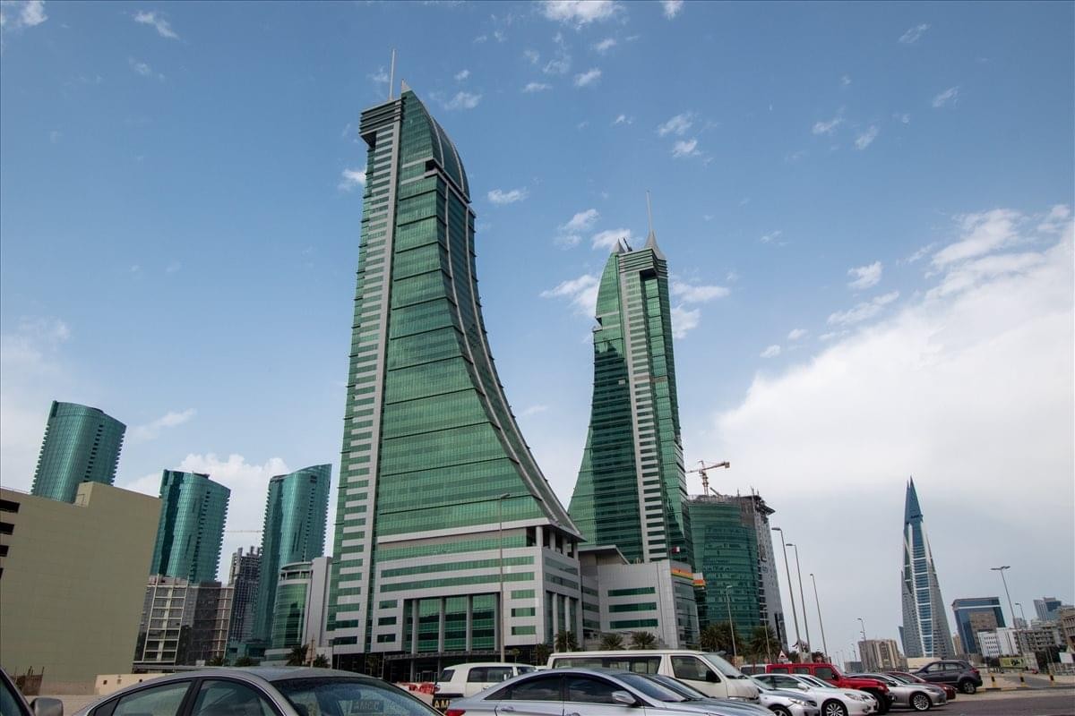 Exterior view of the striking curved glass towers at East Tower, Bahrain Financial Harbour.