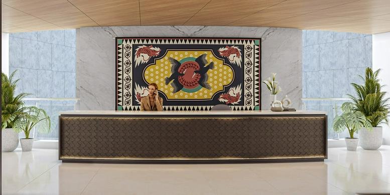 Symmetry-focused reception area at Eldeco Center featuring a patterned front desk and colorful wall tapestry.