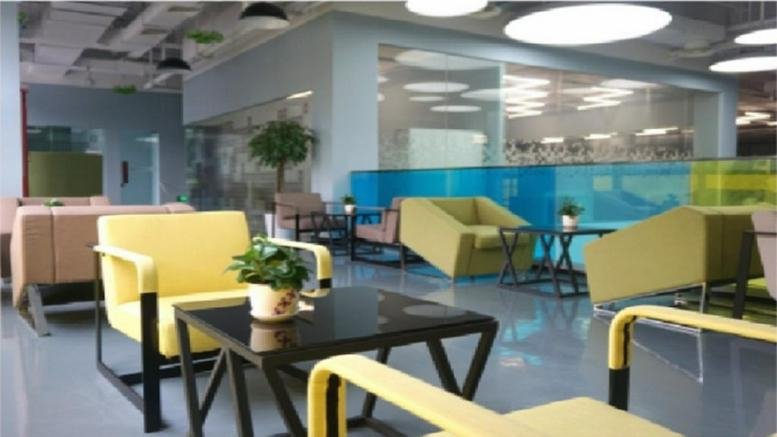 Spacious communal lounge at the Base Construction Project of Financial Gang Backsta with yellow and green armchairs.
