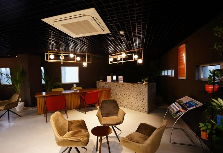 Warmly lit reception area at First India Place, 2nd Floor Sushant Lok, Phase 1, Block B, Mehrauli Gurgaon Road.