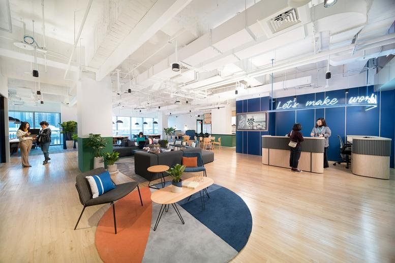 Spacious communal lounge at Levels 5-6, Gaotie East 2nd Road, Zhubei City, Hsinchu, Taiwan with colorful rugs and plants.