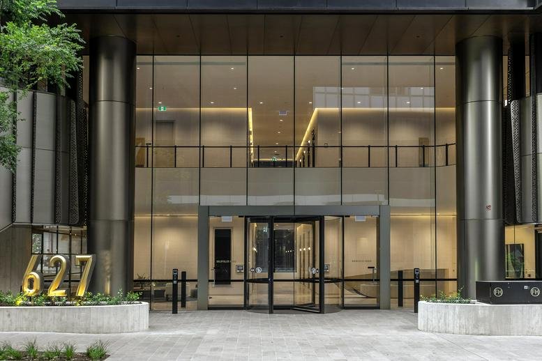Exterior view of the glass entrance and modern facade of Goldfields House, 627 Chapel Street.