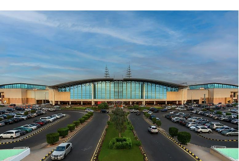 Exterior view of the wide glass and stone facade at Granada Mall (New Extension).