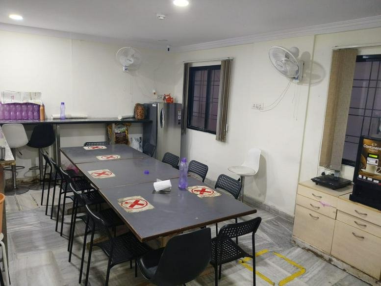 Communal dining area at Greenlands Road, Kundanbagh Clolny Bagumpet, Hyderabad with long table and seating.
