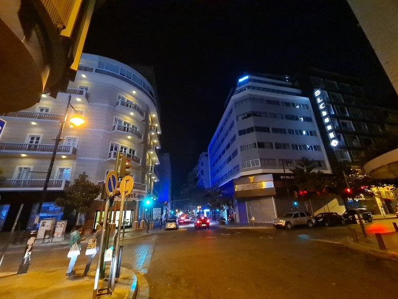 Exterior street view of the Modca Bldg. and surrounding city architecture at night.