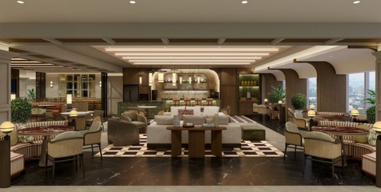 Modern open-plan lounge area with diverse seating arrangements and city views through large windows.