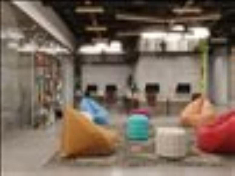 Spacious coworking area with colorful bean bags at Ground Floor, Hilal Bank Building.