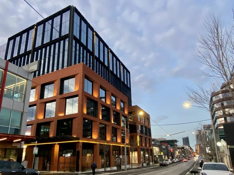 Modern architectural exterior of the Hub Church Street building showing brick and glass facades.
