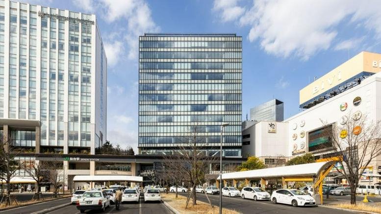 Exterior view of the modern glass facade at JR Sendai East Gate Building.