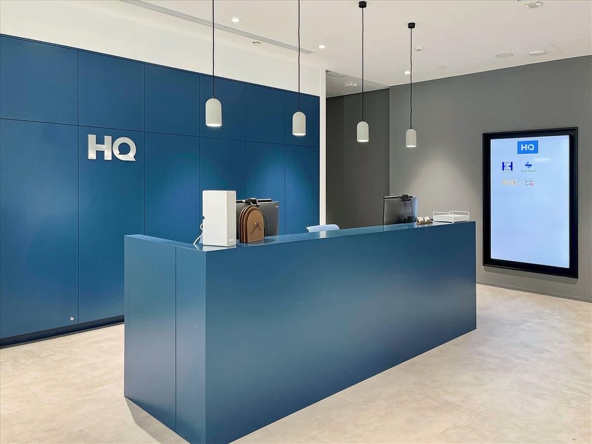 The modern blue reception desk at K11 Atelier, 728 King’s Road.