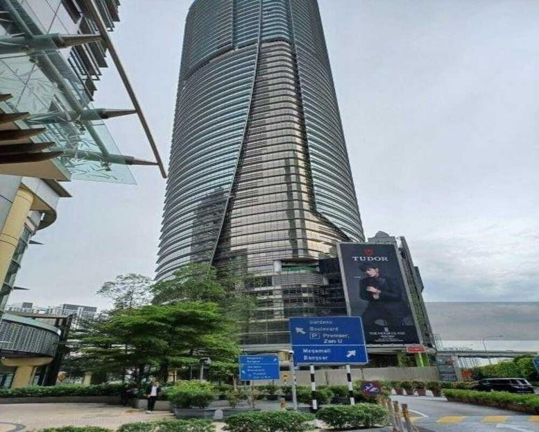 Exterior view of the curved glass facade of The Gardens North Tower Lingkaran Syed Putra.