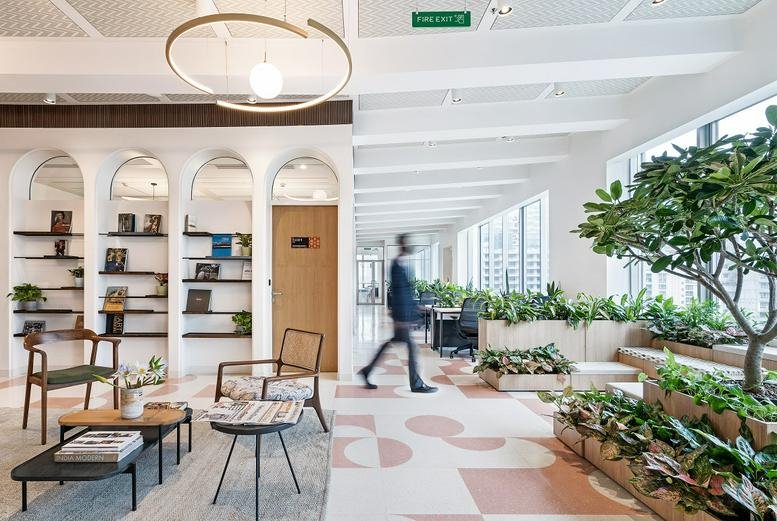 Modern reception lobby at L6 Peninsula Towers, Peninsula Corporate Park, with stylish seating and indoor trees.