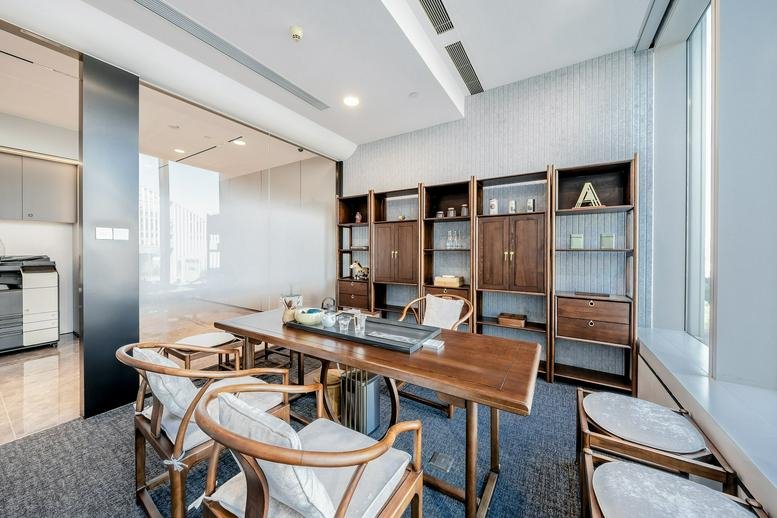 Meeting room with wooden tea table and traditional chairs at Lanrun Landmark Plaza.
