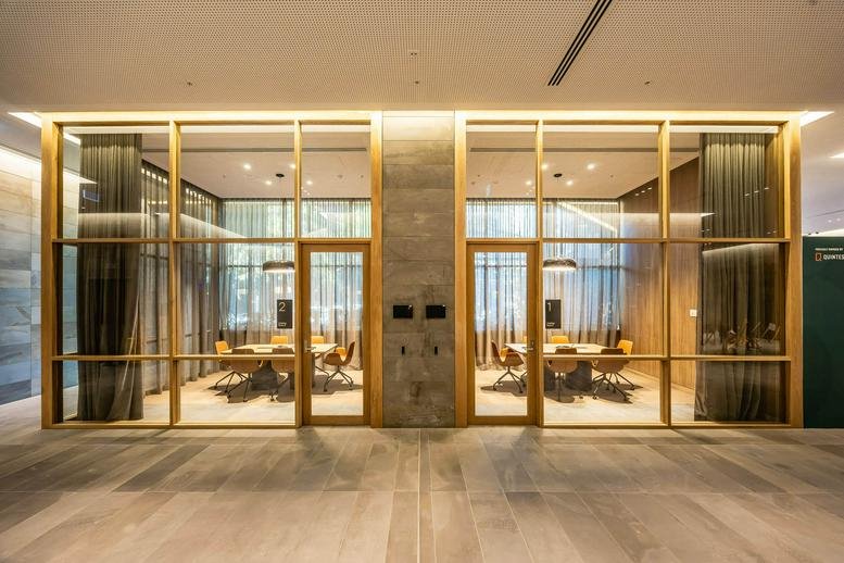 Symmetry in design at the dual glass-walled meeting rooms of M/30, Pirie Street, Adelaide, South Australia.
