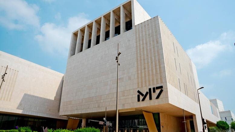 Exterior view of the modern stone-clad M7 Building in Doha.