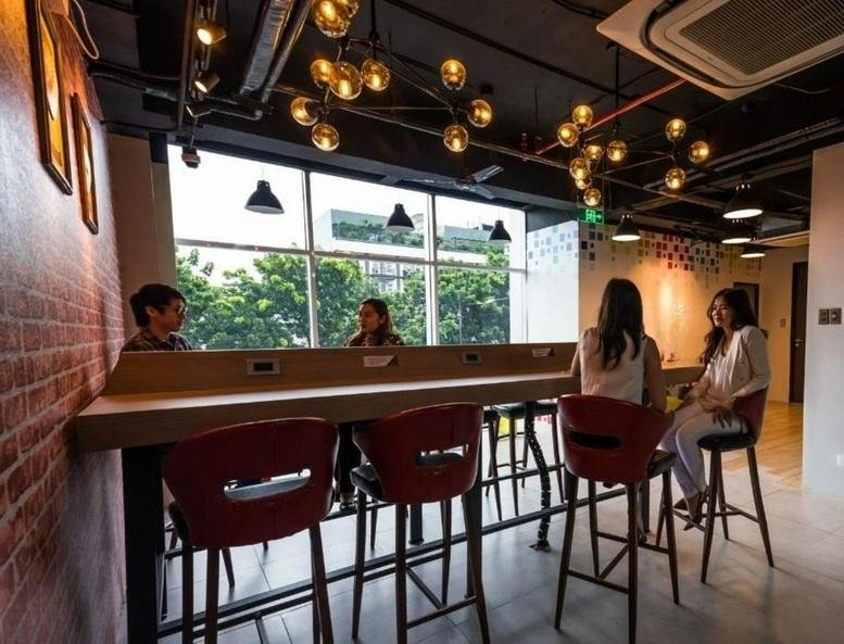 Spacious coworking lounge at Main Building, Ben-Lor IT Center, Quezon Avenue, Diliman, Quezon City with bar seating.