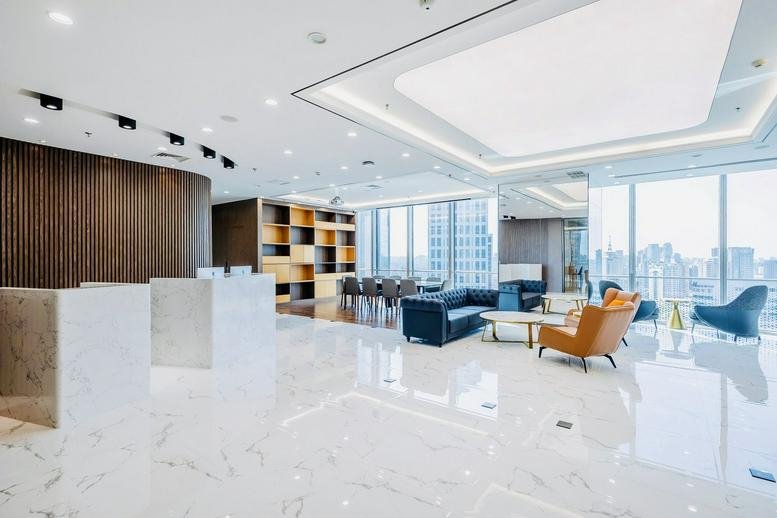 Spacious reception and lounge at Modern International Finance Center with marble floors and city views.