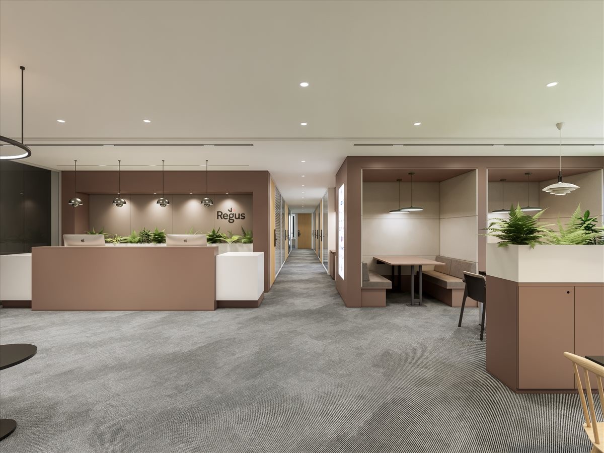 Reception lobby featuring a wood-toned front desk and comfortable seating booths.