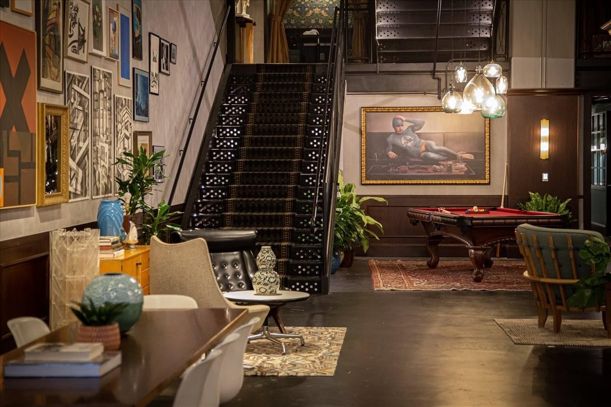 Luxury Office Spaces in Capitol Piazza featuring a grand staircase and an elegant billiard area.