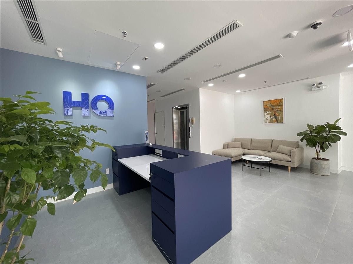 Professional reception area of Songha Building with blue branding and lounge seating.