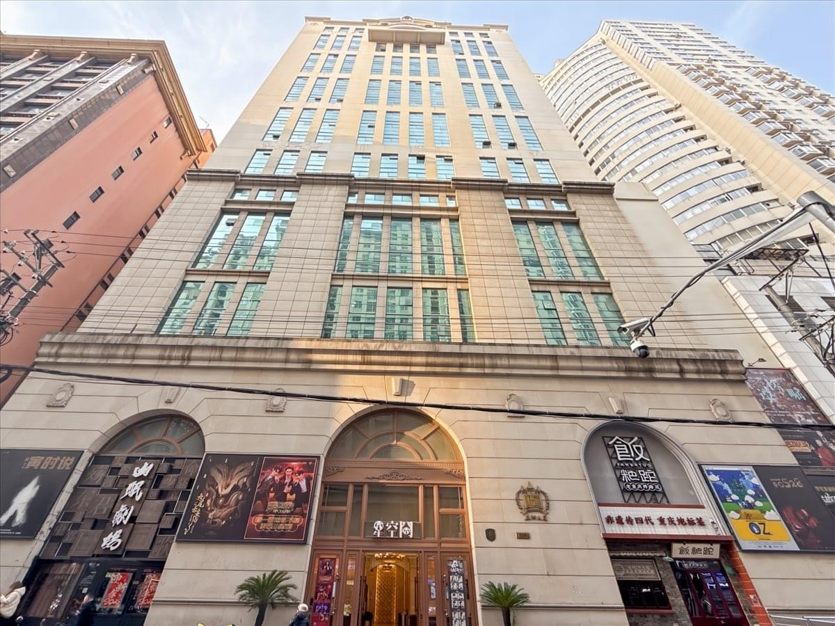Exterior view of the classic stone facade building at No. 663, Jiujiang Road, Huangpu District.