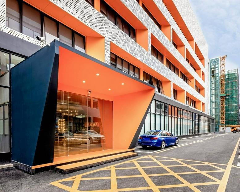 Exterior view of the vibrant orange and black facade at 1-6 Floor, Number. 30, Lane 1, Xin’an 3rd Road.