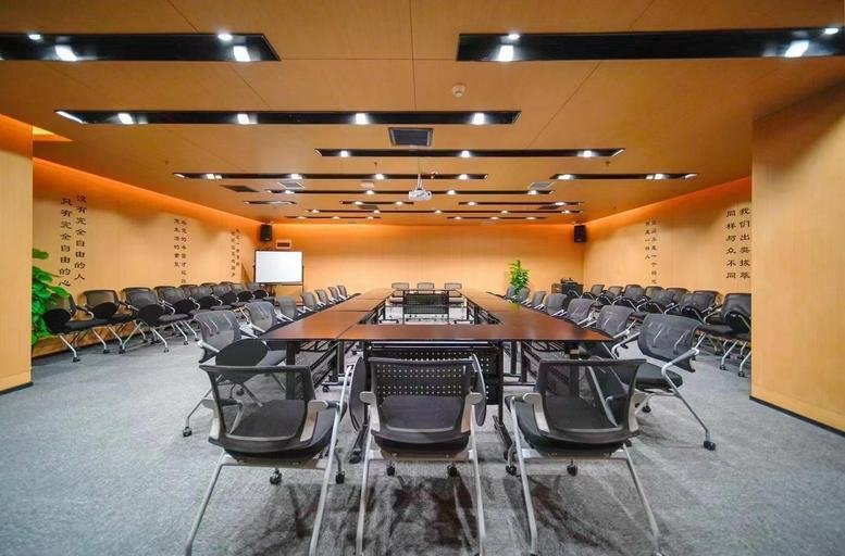Meeting room at Number 88 North Street, Jiahui Plaza with a large wooden conference table and rows of chairs.