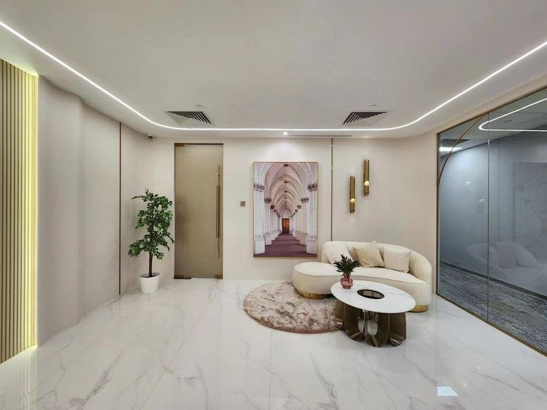 Spacious reception area at OCBC Centre with marble floors and curved LED ceiling lighting.