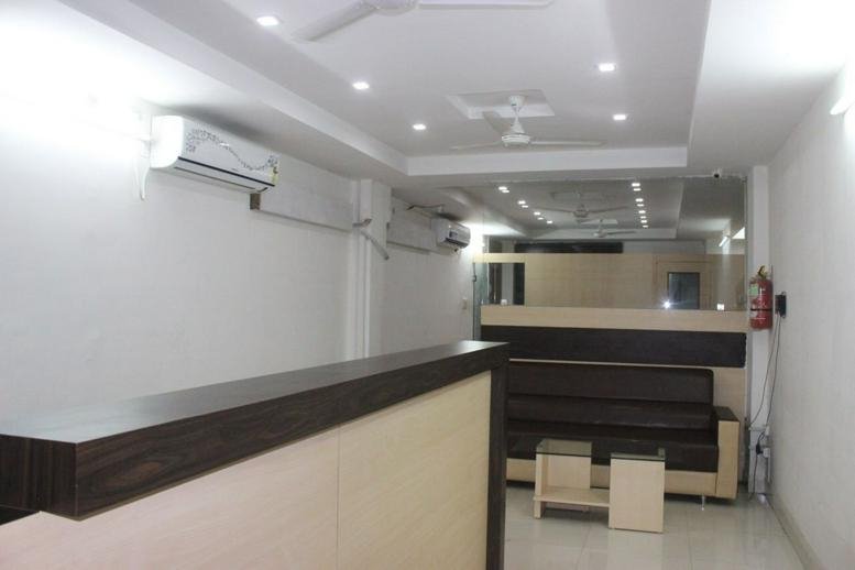 Reception area with counter and seating.