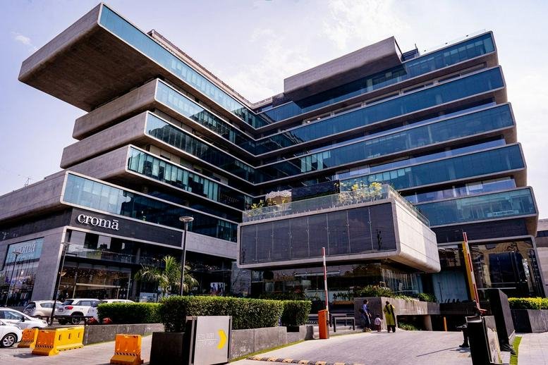 Exterior view of the contemporary tiered glass facade at Apollo Premier.