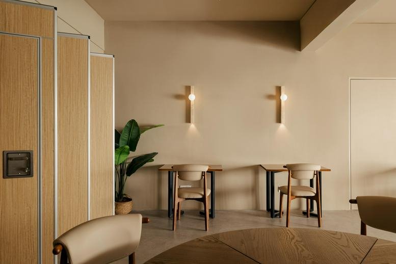 Bright dining area at 1-1 & 3-1, Jalan 26/70a featuring wooden tables and cross-shaped wall sconces.