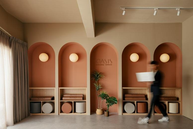 Warm communal area at 1-1 & 3-1, Jalan 26/70a featuring arched niches with soft lighting and shelving.