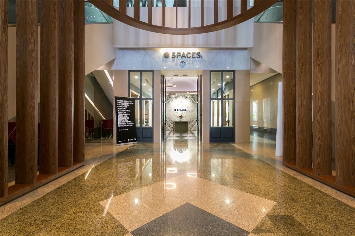 Elegant entrance lobby of Empire Tower featuring polished floors and wooden accents.