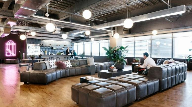 Spacious communal lounge at 1 South Wuning Road, Jing'an District, featuring a large sectional leather sofa.