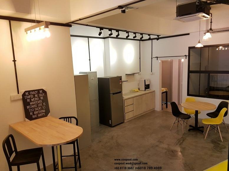 Spacious communal breakout area and kitchenette with modern track lighting at 1 Tebrau No. B03-13.