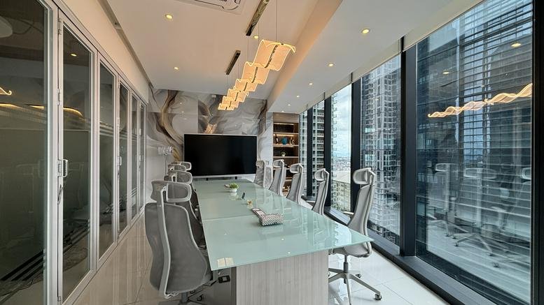 Spacious boardroom at Park Triangle Corporate Plaza, 11th Avenue, BGC, Taguig City with a large screen and city views.