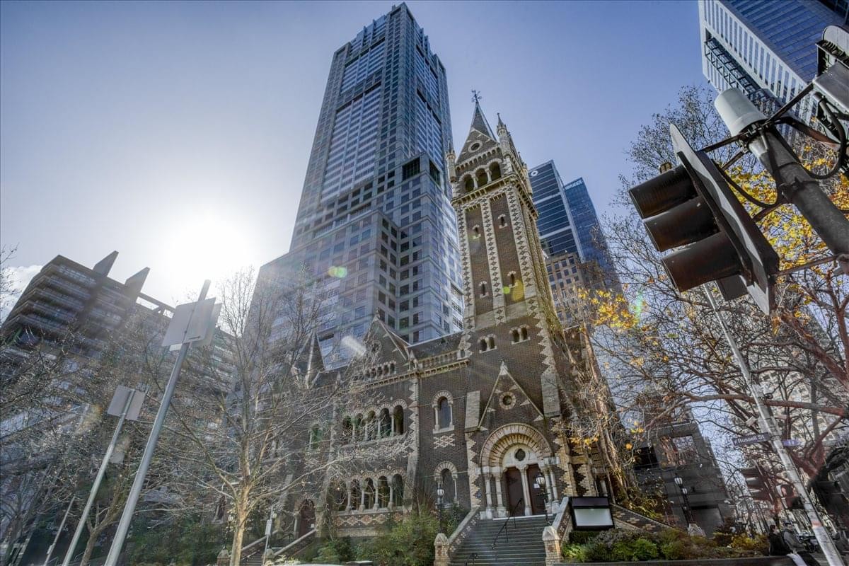 Exterior view of the landmark skyscraper and historic church at 120 Collins Street.