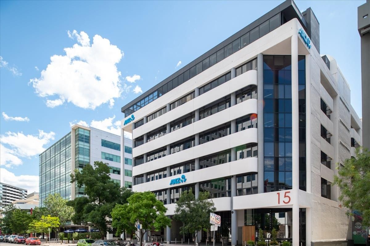 Exterior view of the white multi-story office building at 15 Moore Street, Canberra.