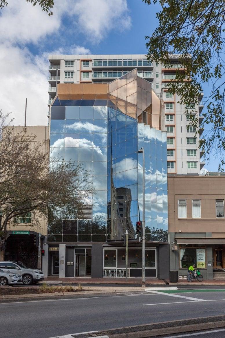 Exterior view of the modern glass-facade building at 155 Waymouth Street.