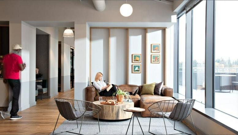 Spacious communal lounge at 16 Qi Xia Lu, Pudong New District with leather sofas and floor-to-ceiling windows.
